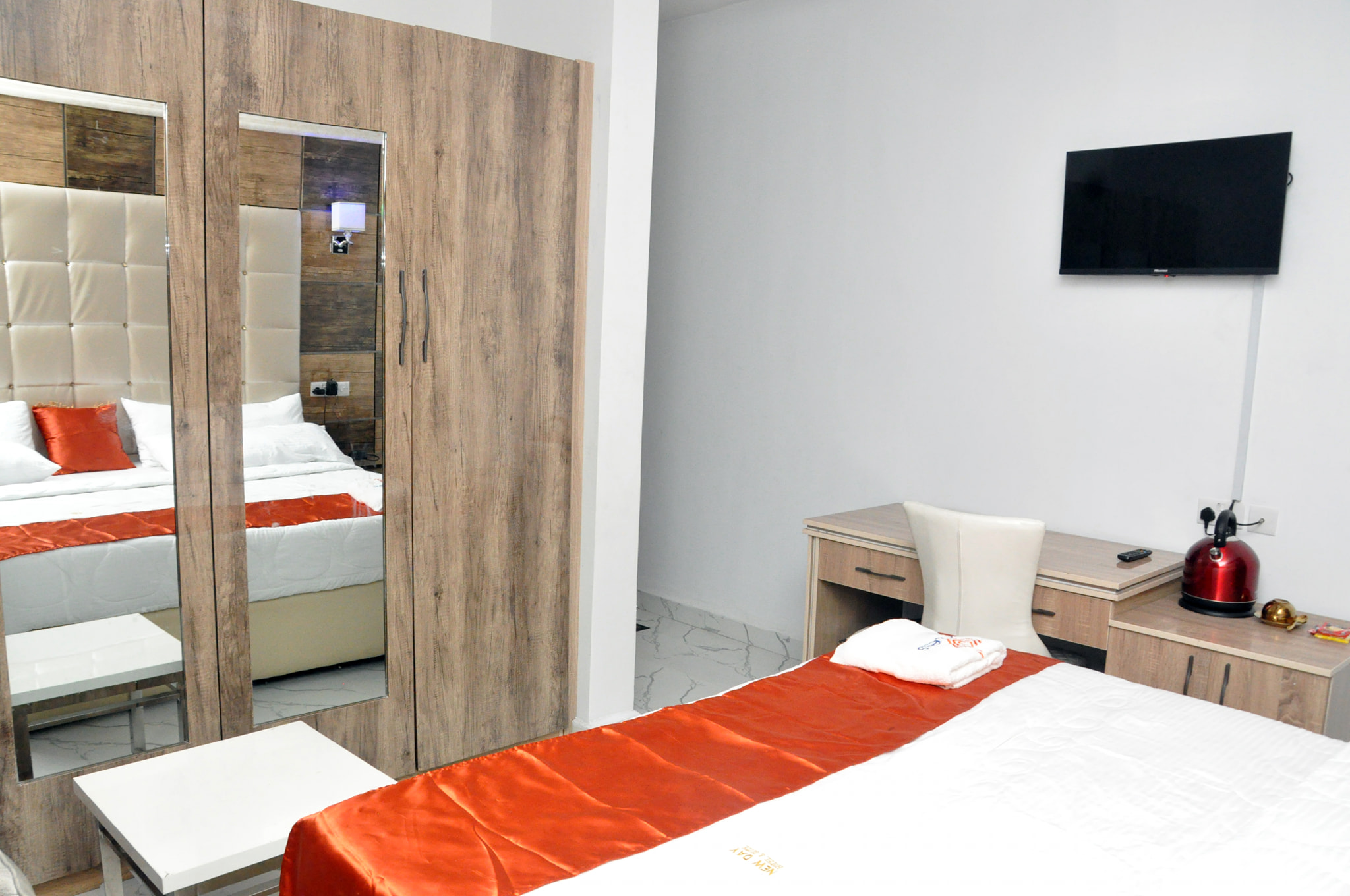 New Day Hotel and Suites